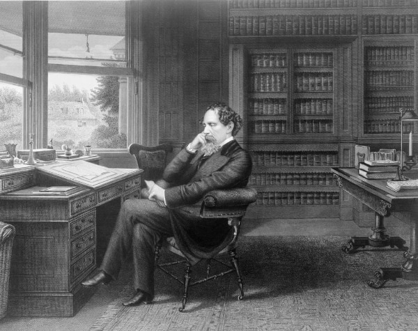 Charles Dickens at his desk.